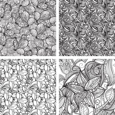 Dört pürüzsüz desenli el yapımı, siyah beyaz yapraklar..