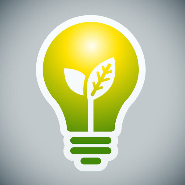 Свет лампы с молодыми побегами внутри на сером фоне
.