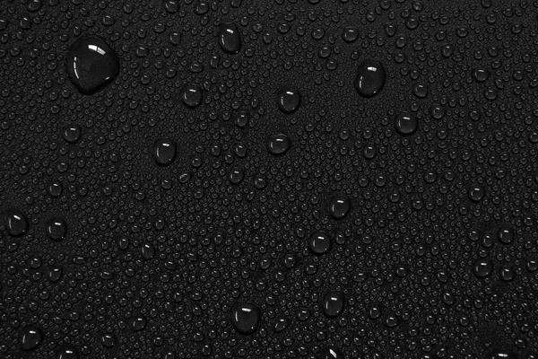 Wassertropfen Auf Schwarzem Hintergrund — Stockfoto