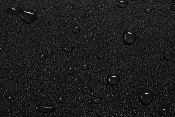 Waterdruppels Een Zwarte Achtergrond — Stockfoto