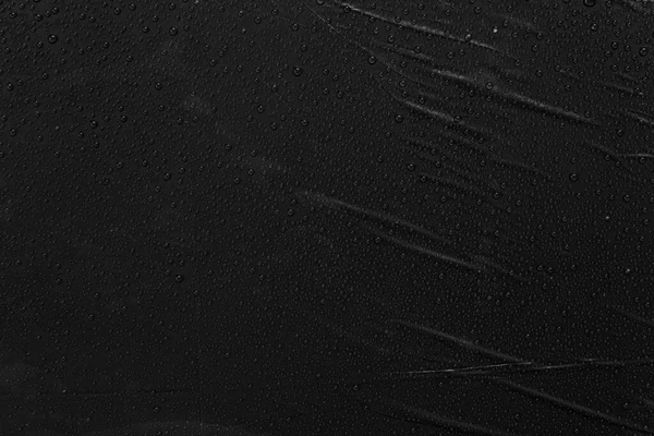 Siyah Plastik Zemin Üzerinde Damlacıkları — Stok fotoğraf