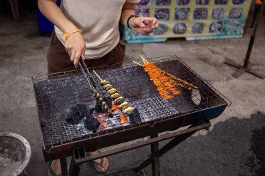 2 May 2024 Chiang Khan Walking Street, a tourist attraction in Loei Province, Thailand, next to the Mekong River separating Thailand and Laos. clipart