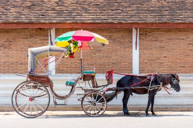 January 11, 2025, Wat Phra That Lampang Luang, Thailand, a local horse-drawn carriage for carrying tourists. clipart