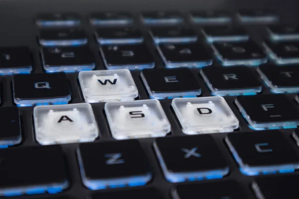 White Highlighted Gaming Keys Blue Light Powerful Dark Notebook Keyboard — Stock Photo, Image