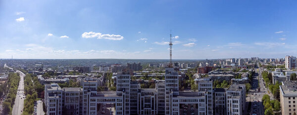 Aerial panorama on Derzhprom building and streets with blue sky cloudscape in spring Kharkiv city center, Ukraine. Constructivist architecture style