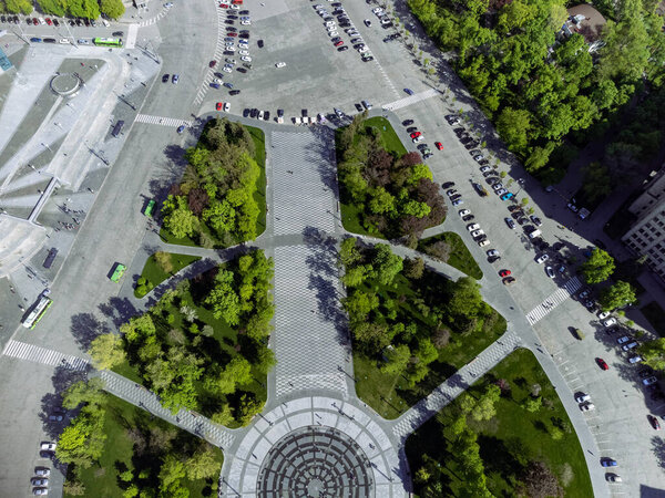 Spring city aerial on Freedom Svobody Square with a circle fountain look down. Kharkiv, Ukraine