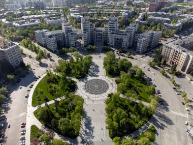 Aerial look down view of Derzhprom building on Freedom Square with fountain and green park in Kharkiv city, Ukraine clipart