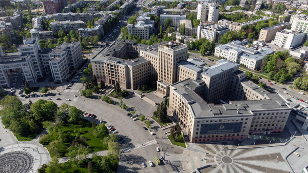 Aerial look down view on Karazin University northern building on Freedom square in spring Kharkiv city, Ukraine. (Translation - Karazin University, classics ahead of time)