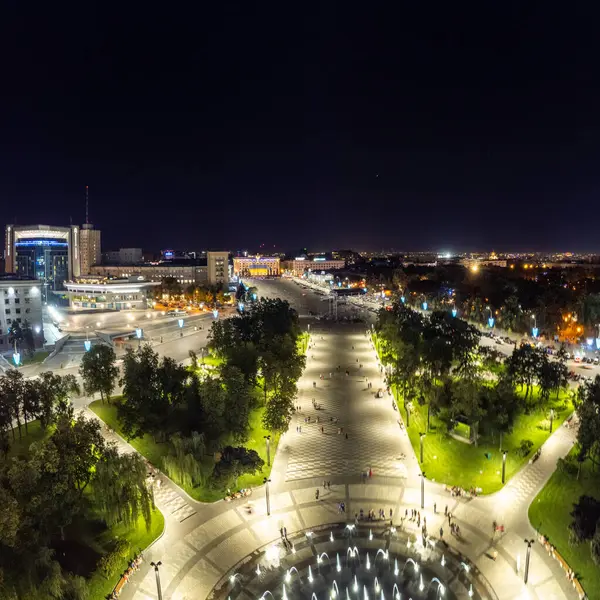 stock image Aerial night view of Freedom Square with fountain and illuminated buildings in Kharkiv city, Ukraine