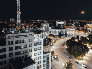 Aerial night view from Derzhprom building on Freedom Square in illuminated Kharkiv city, Ukraine clipart