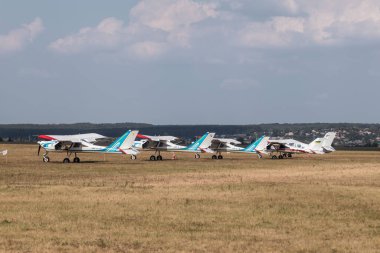 Kharkiv, Ukraine - August 29, 2021: ViS-3 KhAZ-30 ultralight monoplane, ukrainian planes displayed on grass field during KharkivAviaFest airshow clipart