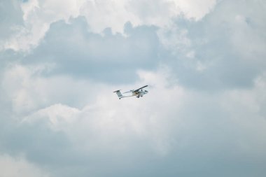 Aeroprakt A-20 Ukrainian tandem ultralight aircraft in cloudy sky on airshow clipart