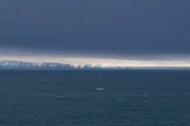 Austofonna glacier with its sheer slopes overlooking the sea, Svalbard Islands. High quality photo clipart