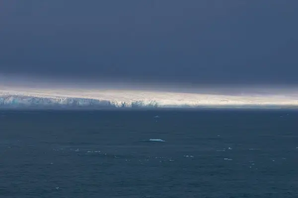 stock image Austofonna glacier with its sheer slopes overlooking the sea, Svalbard Islands. High quality photo