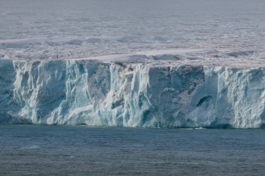 Austofonna glacier with its sheer slopes overlooking the sea, Svalbard Islands. High quality photo clipart