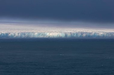 Austofonna glacier with its sheer slopes overlooking the sea, Svalbard Islands. High quality photo clipart