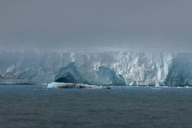 Austofonna glacier with its sheer slopes overlooking the sea, Svalbard Islands. High quality photo clipart