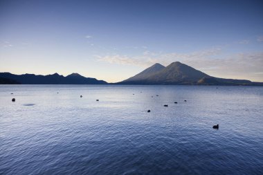 Lake Atitlan with its Volcanoes in Guatemala. High quality photo clipart