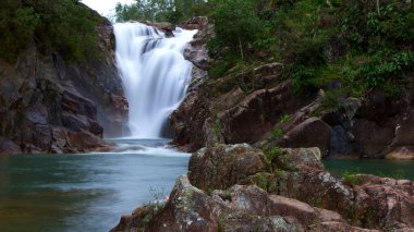 Motion blur of Big Rock Falls in Mountain Pine Ridge Forest Reserve, Belize. High quality photo clipart