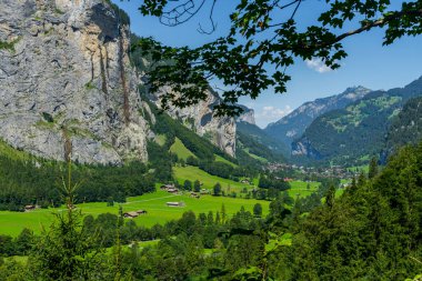 Incredible places of Lauterbrunnen in Switzerland. Waterfalls, mountains, meadows, rivers. beautiful scenery clipart