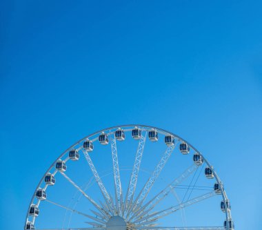 Ferris wheel attraction in center of Gdansk, Poland. Lot's of copy space. Sky background