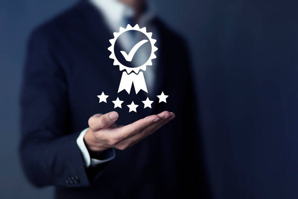 Businessman, entrepreneur, showing signs ISO standard of business and industry to certify the quality and environmental management system. through ISO certification