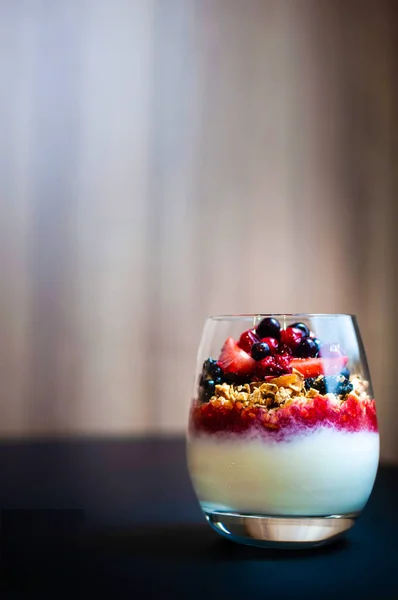 stock image Yogurt with baked granola and berries in small glass - Healthy Breakfast