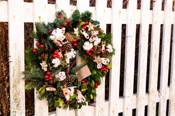 stock image Woodbridge Suffolk UK January 07 2022: A Christmas wreath displayed on a fence for passersby to enjoy and look at during the festive period