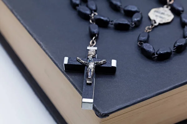 bible and crucifix on white background