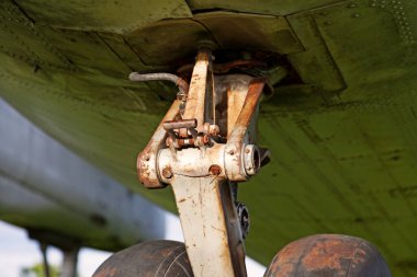 detail from landing gear to aircraft