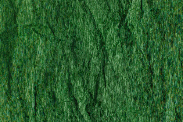Craft Paper Texture or Background in bright green color. Close-up.