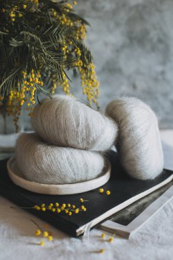 Balls of wool yarn for hand knitting on a notebook. Concept for handmade. Place for text.