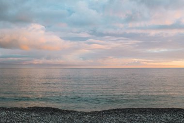 Amazing view of an Adriatic sea on a sunset, Montenegro. Beautiful cloudy sky. Travel destination in Montenegro.