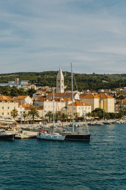 Amazing view of yacht marina and old town Supetar, Brac island, Croatia. Beautiful sunny day. Travel destination in Croatia. clipart
