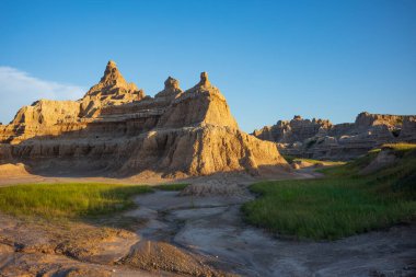 A view of a sunset along the Door Trail at Badlands National Park in South Dakota.  clipart