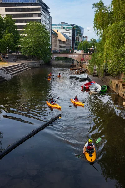 Stock image Oslo, Norway - June 20, 2023: Kayakers navigate the waters of the Akerselva, a river that runs through the heart of the city, during a summer afternoon. 