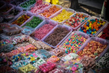 Assorted multicolored handmade sweets on the stall at the marketplace