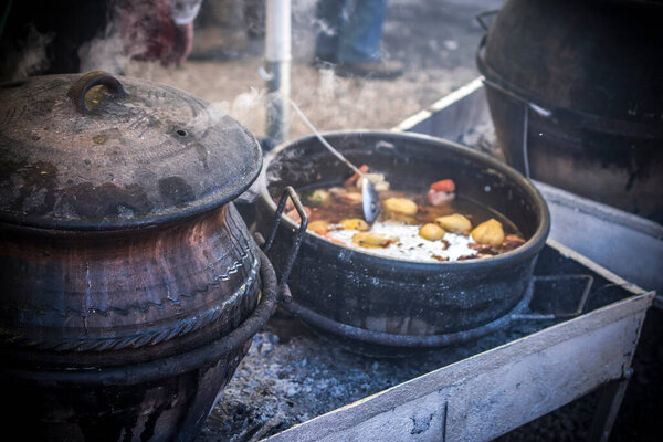 Serbian traditional stew cooked in big pots