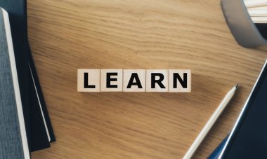 LEARN wording with book or textbook and pencil. Growth idea of business working and education learning success. Businessperson and student skill training and knowledge development