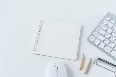 Top view of modern working desk with keyboard, pencil, notebook or notepad. Flat lay photography of business workplace and education learning concept. Conceptual of still life and lifestyles