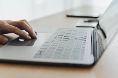 Businessperson or student or freelancer using laptop or computer at home. Business and finance working or education learning online via internet and cyberspace. Studying success idea concept