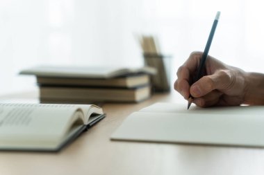 University student studying, writing and reading book or textbook. Learning or training skill course or classroom online at home. Idea of education success. Knowledge and cognition conceptual.