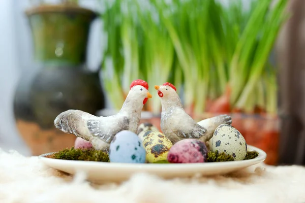 toy chicken and cockerel with easter eggs
