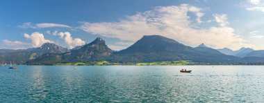 landscape with Lake Wolfgangsee, mountains with mount Sparber, view from the town of Sankt Wolfgang, Alps, Austria clipart