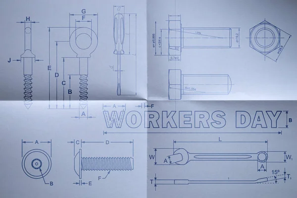 International Workers\' Day. Scheme of tools on paper close up.