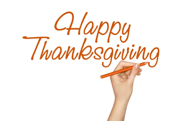 Happy Thanksgiving. Hand writes text on a white background close up.