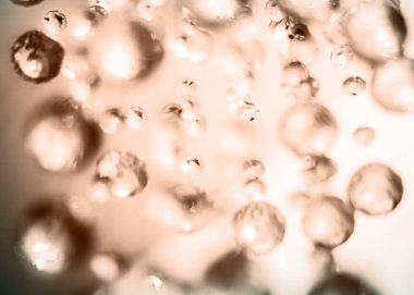 Soyut moka kahverengi yuvarlak çözünmüş asılı kristaller arka plan. Bulanık sihirli ışıklar.