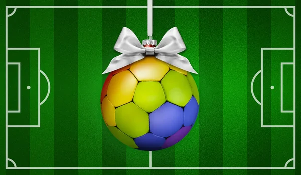 Sport for human rights concept, merry Christmas gift greeting card with soccer ball colored in rainbow colors, on football pitch green background
