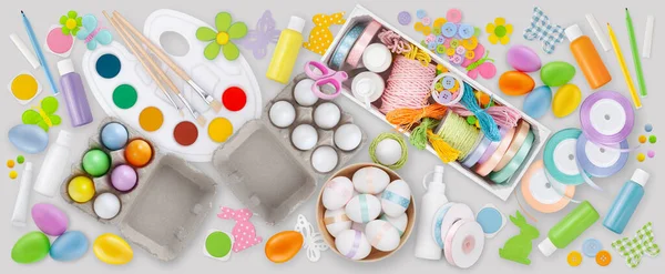 Table Top View of Easter Crafts and Materials for Colorful Egg Decoration and Ornament Making, Colors, Ribbons, tools and Embellishments, DIY Enthusiasts and Creative Minds to Add Joy to the Easter