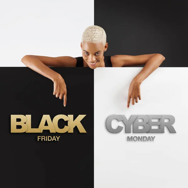 Black Friday And cyber Monday shopping. Smiling black woman pointing at a text on advertising banner commercial sign. Store and mall advertising Billboard guiding shoppers to deals